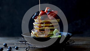 Stack of pancakes with syrup drizzle