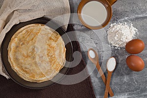 A stack of pancakes on the table for Maslenitsa. Pancake ingredients, Pancake recipe.