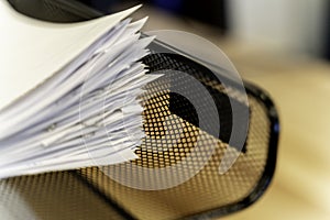 Stack of paper document in office In tray at work