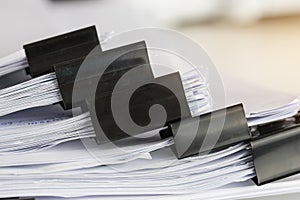 Stack of Paper documents with clip, Pile of unfinished documents on office desk folders. Business papers for Annual Report files,