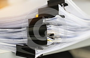 Stack of Paper documents with clip, Pile of unfinished documents on office desk folders. Business papers for Annual Report files,