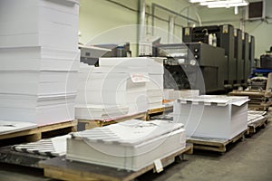Stack of paper in a printing press.