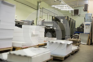 Stack of paper in a printing press.