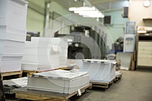 Stack of paper in a printing press.