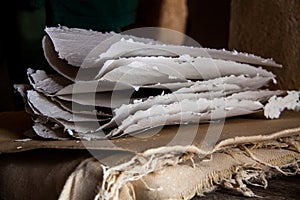 Stack of paper sheets in an ancient paper mill. Old traditional