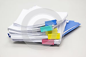 Stack of papers documents in archives files with paper clips on desk at offices