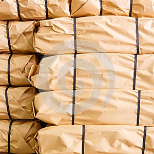 Stack of parcel wrapped in brown recycled paper