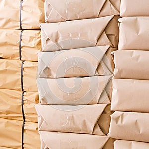 Stack of parcel wrapped in brown recycled paper