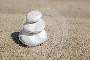 Stack of pebble stones on balance on beach