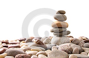 Stack of pebble stones on white