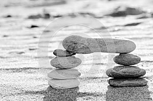 A stack of pebbles in black and white, arch shape, zen concept