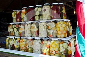 Stack of pickles in stinging bottles in Szeged