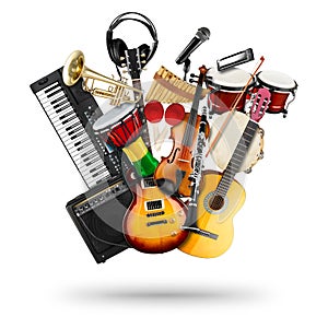 Stack pile collage of various musical instruments. Electric guitar violin piano keyboard bongo drums tamburin harmonica trumpet.