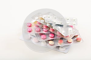 Stack of pills on white background