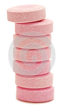 Stack of pink antacid tablets.