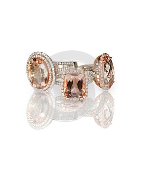 Stack of pink morganite diamond halo set engagment fashion rings