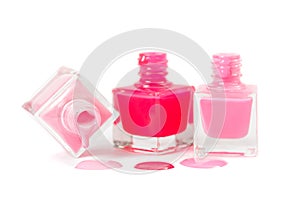 Stack of pink nail polish isolated on white background