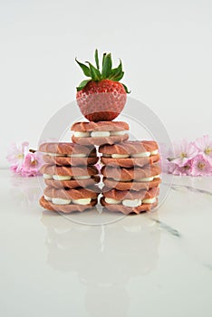 Stack of pink strawberry flavor biscuits or cookies