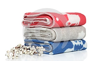 A stack of plaids with flowers on a white background