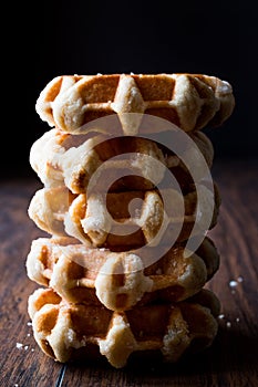 Stack of Plain Belgium Waffle on wooden surface.