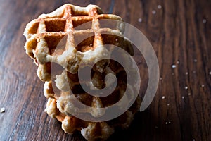 Stack of Plain Belgium Waffle on wooden surface.