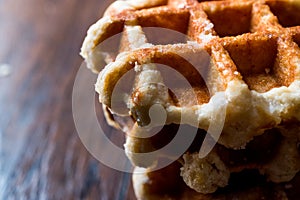 Stack of Plain Belgium Waffle on wooden surface.