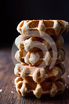 Stack of Plain Belgium Waffle on wooden surface.