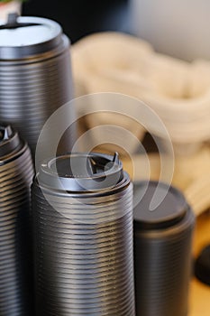 A stack of plastic  coffee cup lids