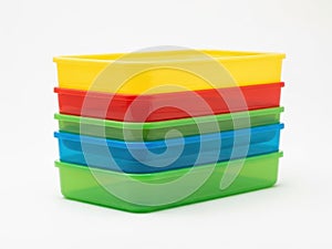 Stack of plastic containers, isolated on white background