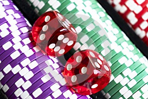 Stack of poker chips with dice rolls isolated background. Poker game concept. Playing a game with dice. Casino Concept for busines