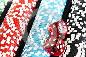 Stack of poker chips with dice rolls isolated background. Poker game concept. Playing a game with dice. Casino Concept for busines