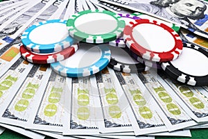 Stack of Poker chips on a dollar bills, Money. Poker table at the casino. Poker game concept. Playing a game with dice. Casino