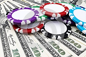 Stack of Poker chips on a dollar bills, Money. Poker table at the casino. Poker game concept. Playing a game with dice. Casino