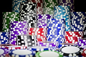 Stack of Poker chips on a green gaming poker table at the casino. Poker game concept. Playing a game with dice. Casino Concept