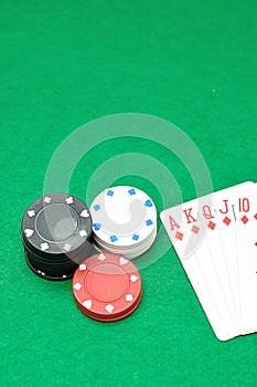 A stack of poker chips with a royal flush