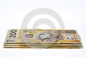 Stack of polish banknotes with white background