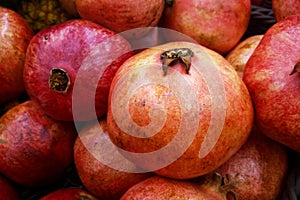 Stack of pomegranates a market stall