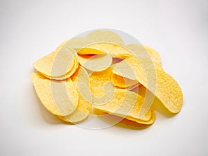 Stack of Potato Chips Arranged on White Background