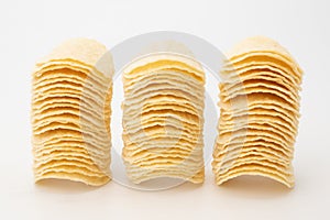 Stack potato chips on white background
