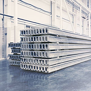 Stack of precast reinforced concrete slabs in factory workshop