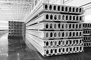 Stack of precast reinforced concrete slabs in factory workshop