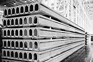 Stack of precast reinforced concrete slabs in factory workshop