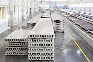 Stack of precast reinforced concrete slabs in factory workshop