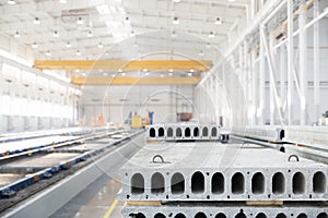 Stack of precast reinforced concrete slabs in factory workshop