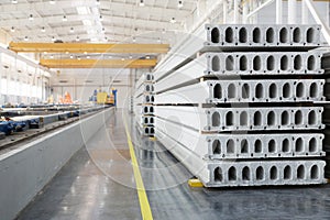 Stack of precast reinforced concrete slabs in factory workshop