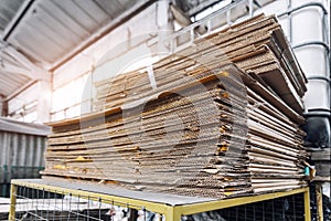 Stack prepared pile of used compressed corrugated cardboard and waste paper wrap collected for recycling and reuse at