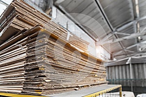 Stack prepared pile of used compressed corrugated cardboard and waste paper wrap collected for recycling and reuse at