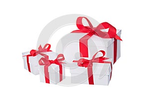 Stack of presents white gifts ribbon red bow isolated on white background