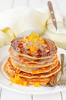 A Stack of Pumpkin Pancakes Topped with Pumpkin-in-Syrup Preserves