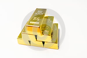 Stack of pure gold bullion bars in bank vault storage. 1kg 999,9 Fine Gold bar ingots background. Precious metal investment,